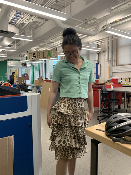 Girl showing off a leopard-printed skirt she mended