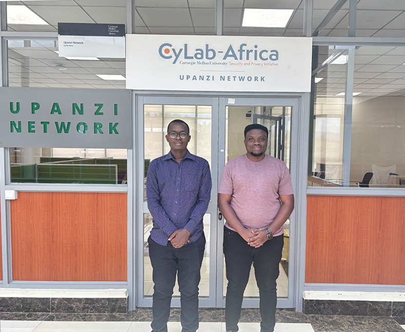  Two men standing in front of a building entrance