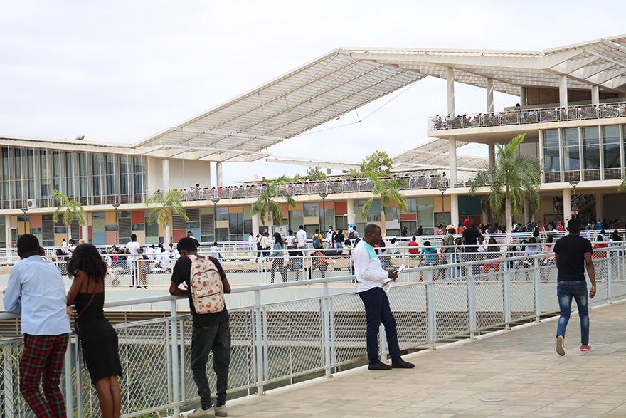 People stand outside academic buildings