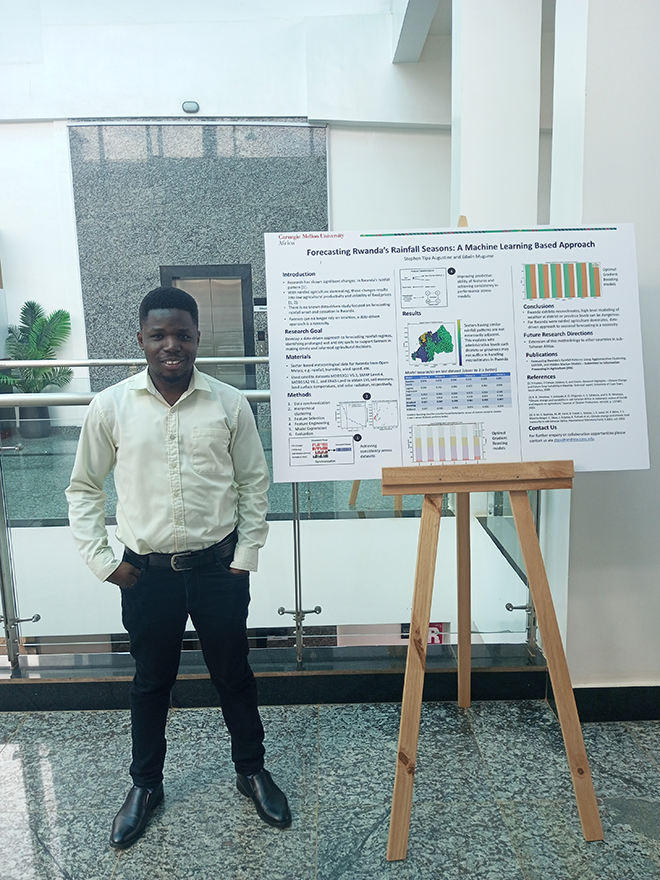 Man standing next to a research poster on an easel.
