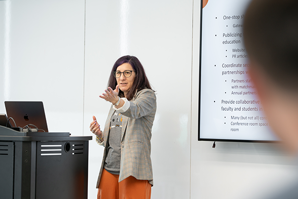 A woman standing at a podium
