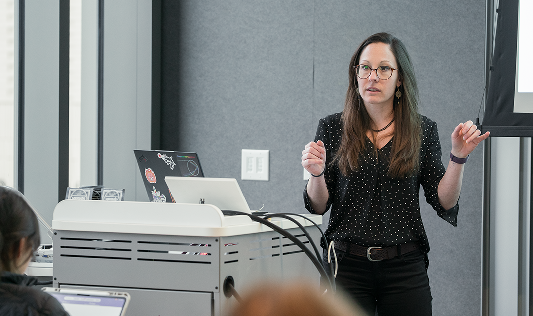 Jana Kainerstorfer presenting at the front of a room