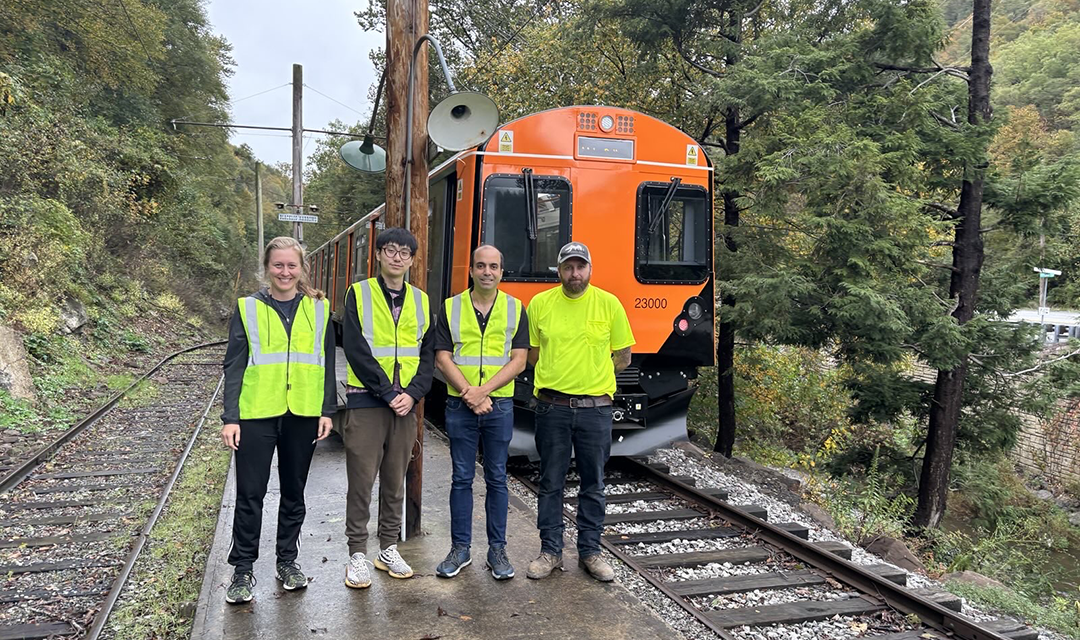Flanigan, Bergés, and civil and environmental engineering Ph.D. candidate Sizhe Ma installing CMU’s sensing technology on a Pop-Up Metro train car. 