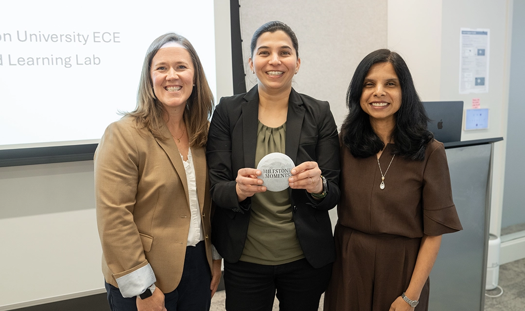 Gauri Joshi with Reeja Jayan and Katie Walsh. Joshi is holding her award proudly.