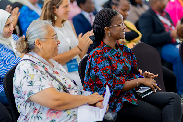 Two women listening to presentation