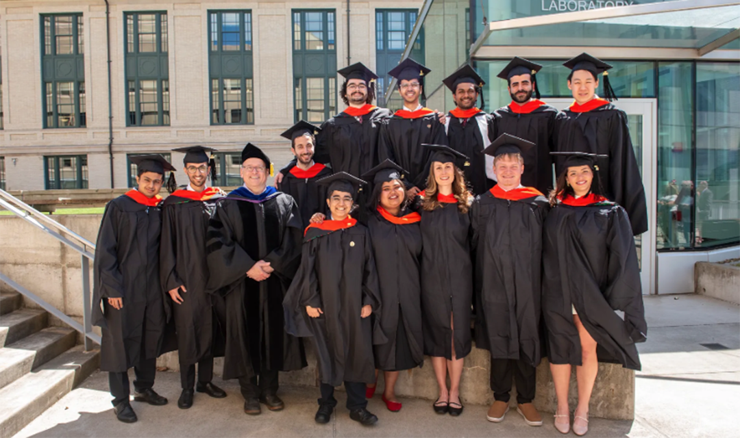 ESTP graduates pose for photo in caps and gowns