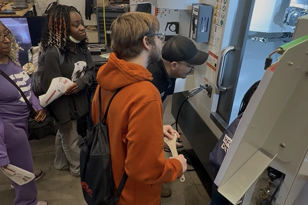 Students watching a demo in a lab