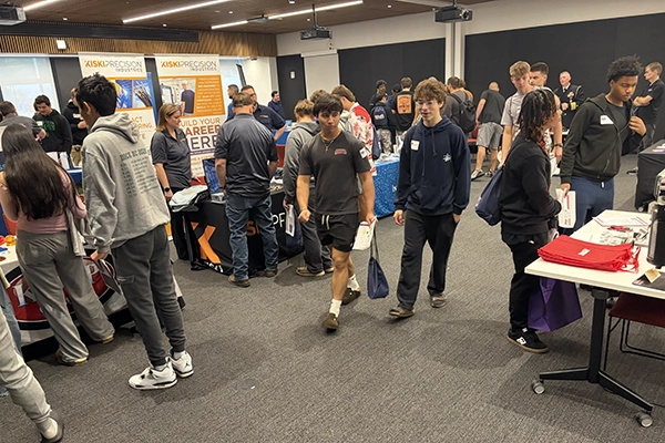Students walking through the expo area