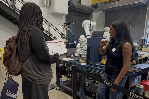 Two female students in a lab chatting