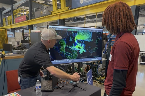 A man demonstrating 3d printing on a computer screen