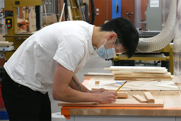 student working on a woodworking project